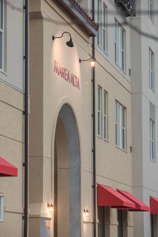 A building with a red awning and a sign that says "Mareia Atria".