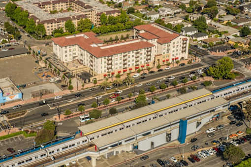 A train is passing through a city intersection.