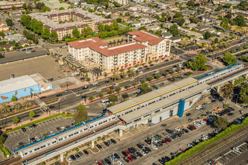 A train is passing through a city intersection.