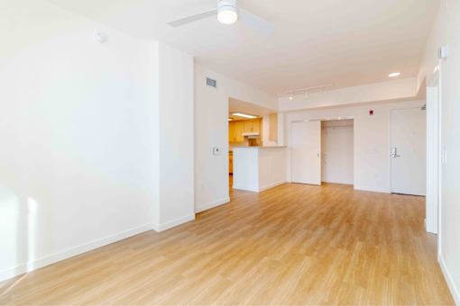 A room with wooden floors and white walls.