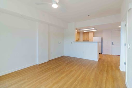 A room with wooden floors and white walls.