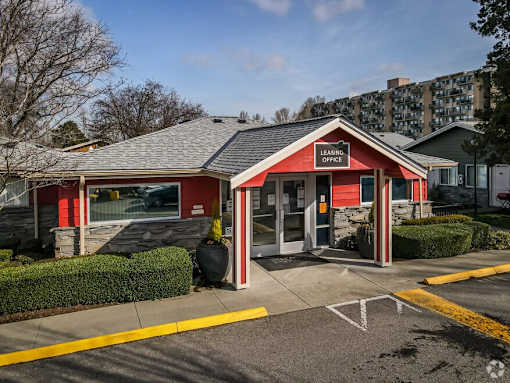 A red and white building with the words "Leasing" on the front.