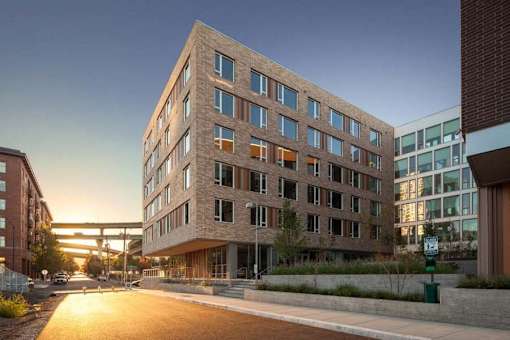 A modern building with a lot of windows is being constructed.
