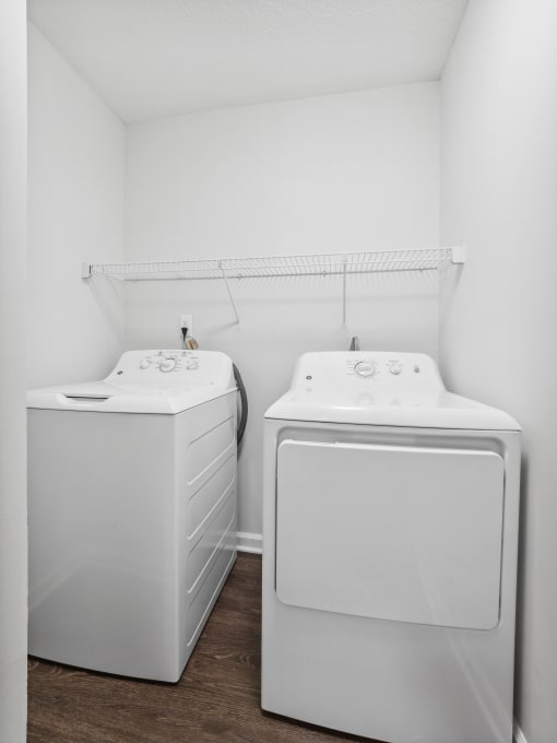 a small laundry room with a washer and dryer