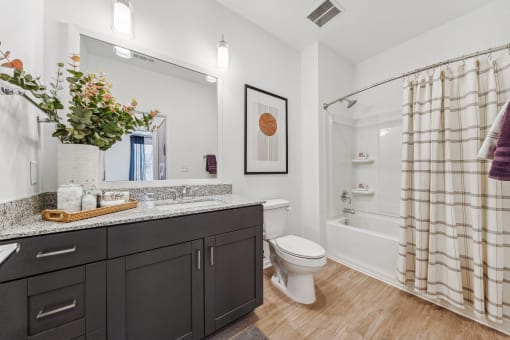 a bathroom with a shower toilet and sink and a mirror  at Plat 4 at Research Triangle, Durham, NC, 27703