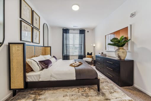 a bedroom with a bed and a dresser  at Plat 4 at Research Triangle, Durham, NC, 27703