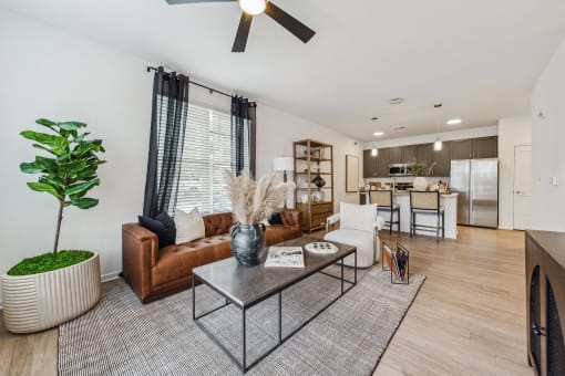 a living room with a couch and a coffee table  at Plat 4 at Research Triangle, Durham, NC