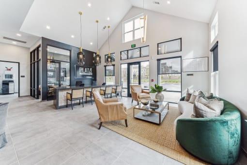 a living room with a couch and chairs and a table at Plat 4 at Research Triangle, Durham