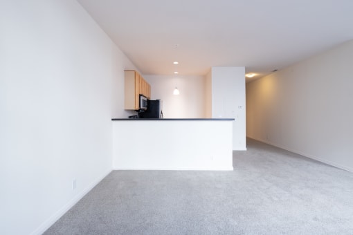 a kitchen and living room in an apartment at 26 West, Managed by Buckingham Urban Living, Indianapolis