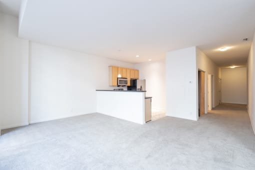 a kitchen and living room in an apartment at 26 West, Managed by Buckingham Urban Living, Indianapolis