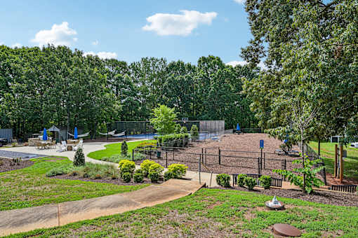 A playground with a swing set and a slide.