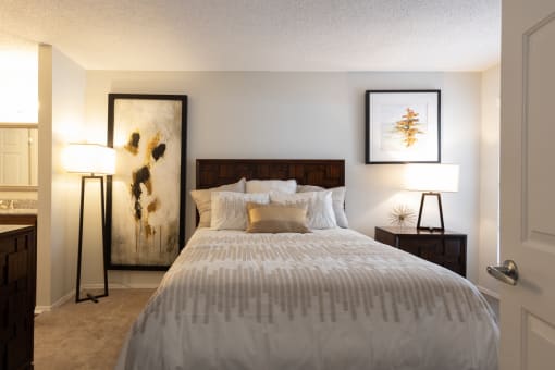Bedroom with a large bed at Altitude at Blue Ash, Blue Ash, OH