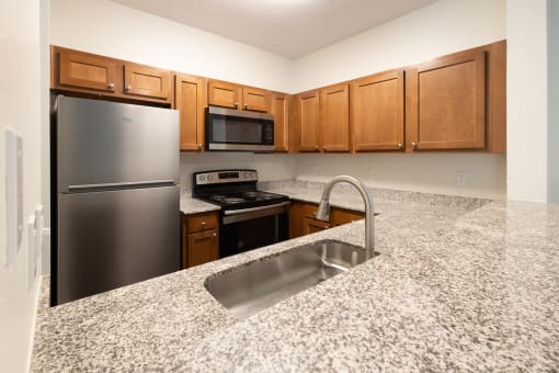 Kitchen with granite countertops at Altitude at Blue Ash, Blue Ash, OH, 45242