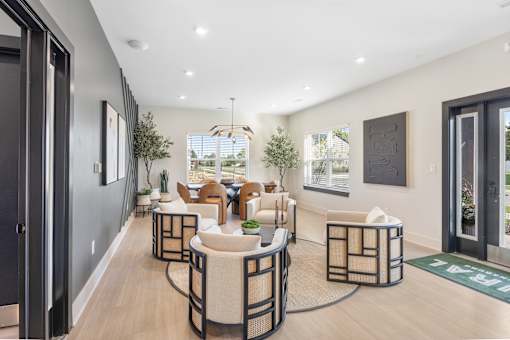 A modern living room with a black and white color scheme.