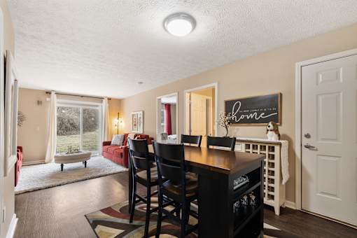 Open living room to dining room at Heritage Trail Apartments in Terre Haute, IN.