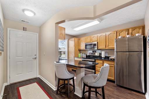 Kitchen with island at Heritage Trail Apartments in Terre Haute, IN.