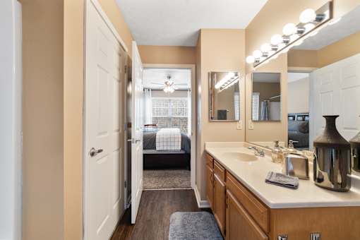 Bathroom with large vanity area at Heritage Trail Apartments in Terre Haute, IN.
