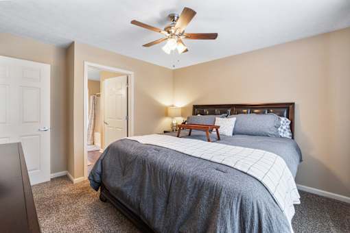Bedroom with ceiling fan at Heritage Trail Apartments in Terre Haute, IN.