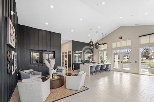 A spacious lobby with a reception desk and seating area.
