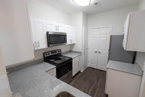 Renovated kitchen featuring appliance at Center Point Apartments, Indianapolis