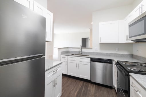 Renovated kitchen featuring appliances at Center Point Apartments, Indianapolis