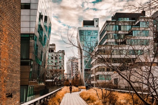 a person walking down a sidewalk in a city