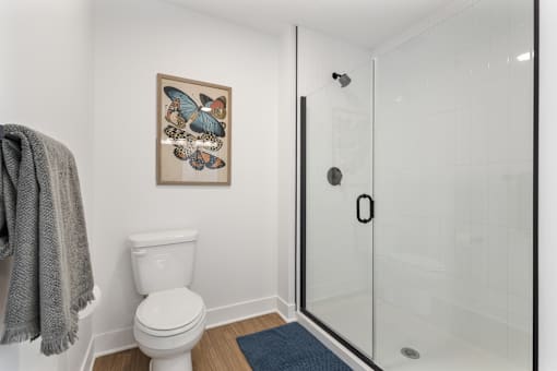 Walk-in glass shower with vertical tile in a Cole Motor bathroom