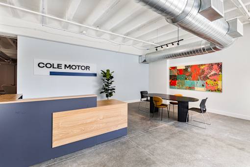Resident lobby with reception desk and original polished concrete floors