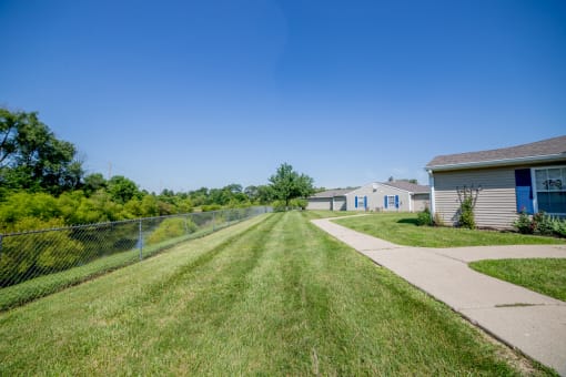 green space with grass in apartment community