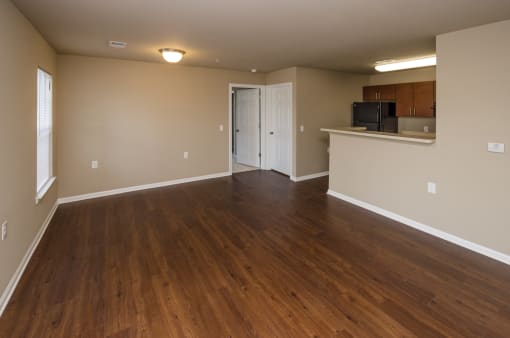 living area in apartment with wooden flooring
