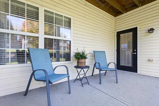 Small Porch with Chairs at Fieldstone at Glenwood Crossing, Cincinnati, OH