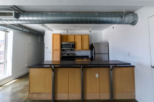 Fully Equipped Kitchen at Janus Lofts, Managed by Buckingham Urban Living, Indianapolis, IN
