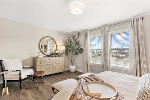 Secondary bedroom with carpet flooring, closet, and hallway access in Mural Lewis Center single-family rental homes