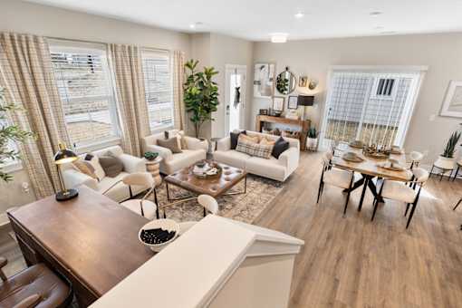 Living room with seating, natural light, and open layout at Mural Lewis Center