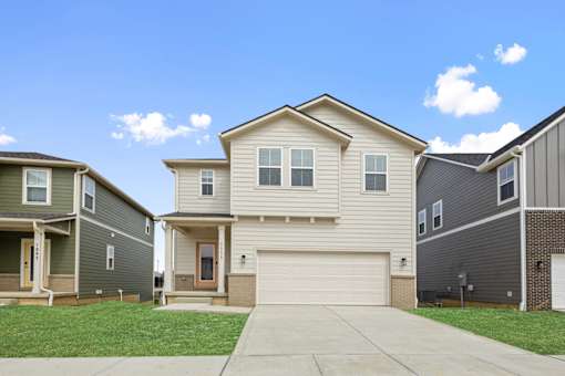 Two-story single-family rental home with modern siding and private entry at Mural Lewis Center in Lewis Center, Ohio