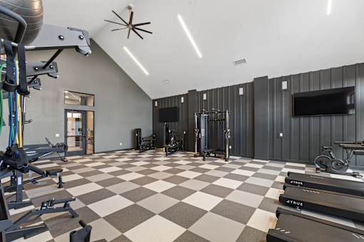 Fitness center with treadmills at Montage West Lafayette Apartments, West Lafayette, Indiana
