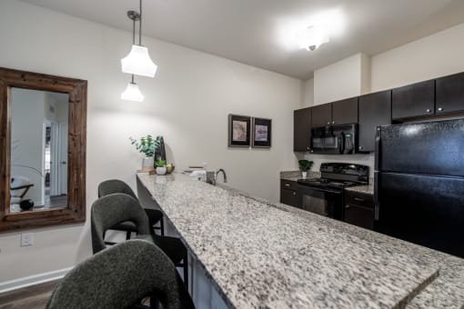 Granite Countertop Kitchen at 310 at Nulu Apartments, Kentucky