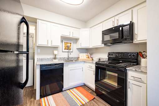 Fully Equipped Kitchen Includes Frost-Free Refrigerator, Electric Range, & Dishwasher at Gramercy Apartments, Indiana