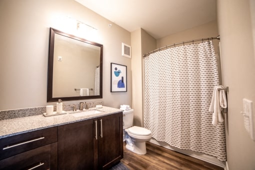 a large bathroom with a shower toilet and sink at The Century at Purdue Research Park-Student, Indiana, 47906