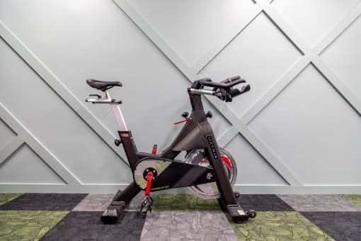 an exercise bike parked in a home gym at 310 at Nulu Apartments-Student, Louisville, KY 