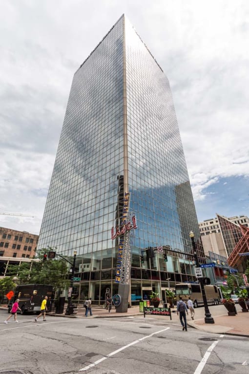 a tall building with a reflection of the sky in it at 310 at Nulu Apartments-Student, Louisville