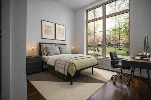 A bedroom with a bed, desk, and chair.