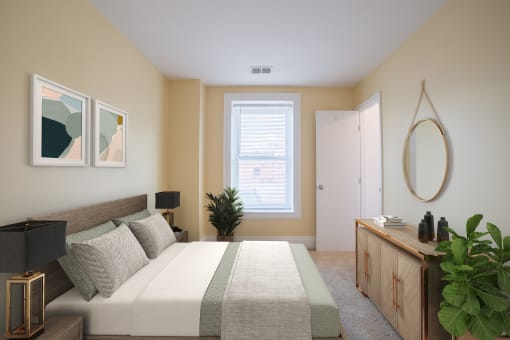 Staged bedroom at The Plaza at Library Square Apartments, Indianapolis, Indiana