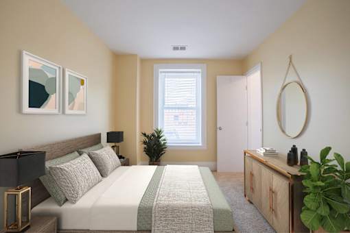 Staged bedroom at The Plaza at Library Square Apartments, Indianapolis, Indiana
