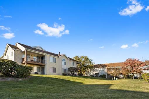 A building with large green space and views at The Winds at Poplar Creek Apartments , Schaumburg