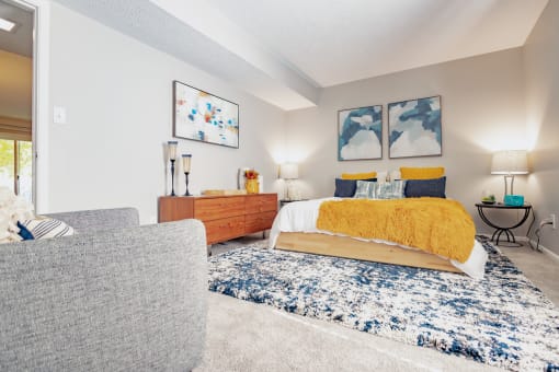 a living room with a bed and a couch
