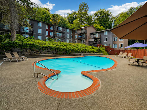 A small pool with a red brick border.