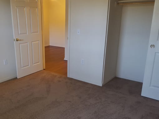 Bedroom with closet space at DOVER WOODS SENIOR APARTMENTS, California
