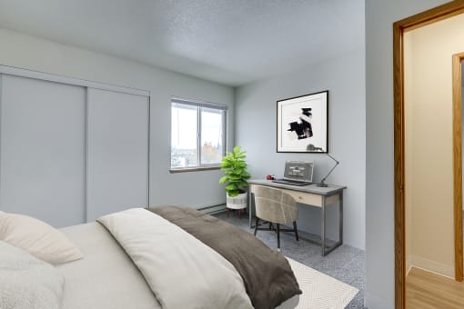 Two-Bedroom Apartments in Sherwood, OR- Township Sherwood- Comfortable bed with Mirror Closet Sliding Door and Spacious Window