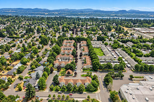 A bird's eye view of a residential area with a large building in the center.